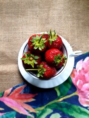 Fresh spring red strawberries in an elegant cup