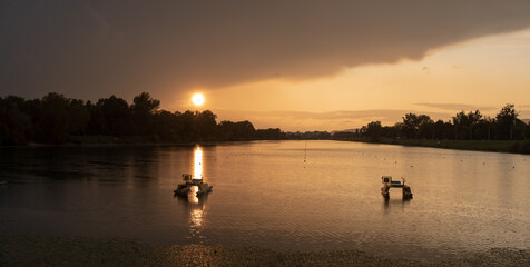Naklejka na ściany i meble Scenic sunset at Jarun lake during rain, Zagreb, Croatia.