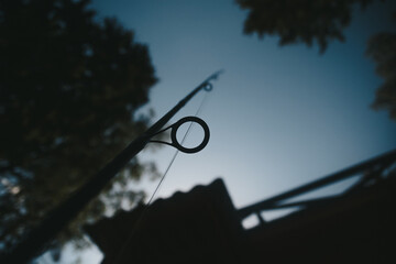 Close-up fishing rod and fishing line is threaded through the rings
