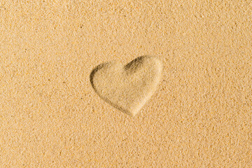 Heart hand-drawn on sand tropical beach. valentines day. Beach holiday concept. Creative, background, copy space, travel, summer. Flat lay