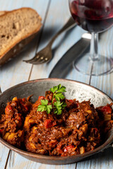 portion of austrian goulash on wood