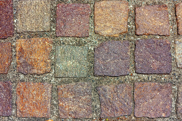 Obraz premium Abstract background of multicolor cobblestone pavement view from above