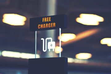 Charging mobile battery station in public area. Cellphone plug of electric power adapter in airport...