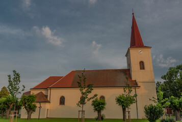 Fototapeta premium Church in Rakvice village in spring sunny color evening