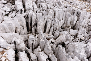 Bright uneven rock in the Austrian Alps. Abstract stone background
