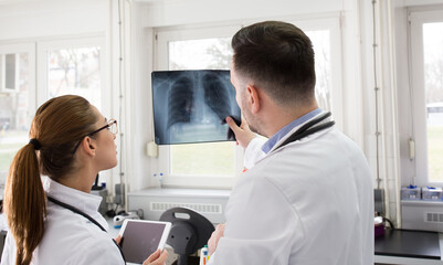 Fototapeta na wymiar Doctors looking at xray of lungs