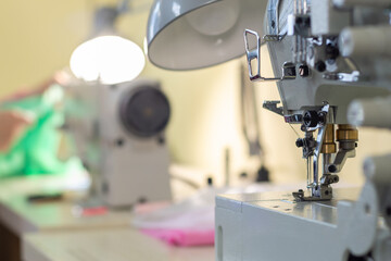 close-up of the needle sewing machine in the workshop atelier