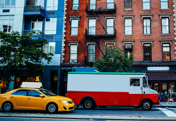 Van automobile on avenue in district with vintage buildings transporting goods for delivery...