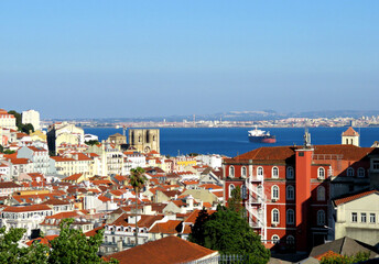 View of Lisbon old town and river from the viewpoint called "Miradouro Sao Pedro Alcantara" in Portuguese,