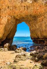 stone arch on the beach, background sea