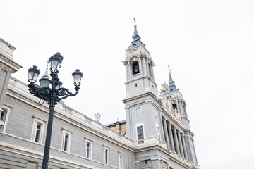 Fototapeta na wymiar The historical Almudena Cathedral in Madrid city center on a rainy winter day in Spain