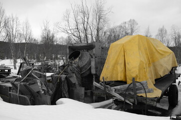 yellow tarp on trailer with cement mixer