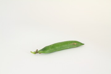 Ripe green peas on a white background, after assembly on the farm