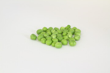 Ripe green peas on a white background, after assembly on the farm