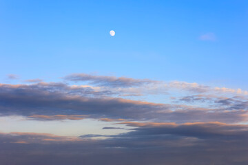 Evening sky with a white moon