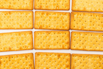 Cracker with salt isolated on white.