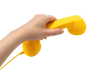 Yellow handset in woman hand isolated on white.