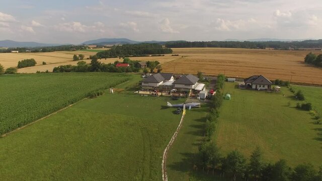 Drone fly ove the lake and fields