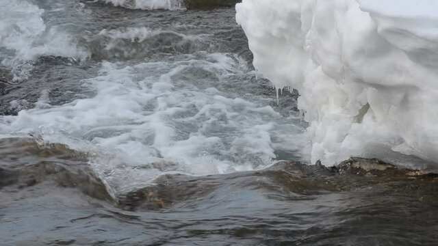 rapid waterfall flow in winter, national river waterfall of Maalselvfossen in Maalselv, northern Norway