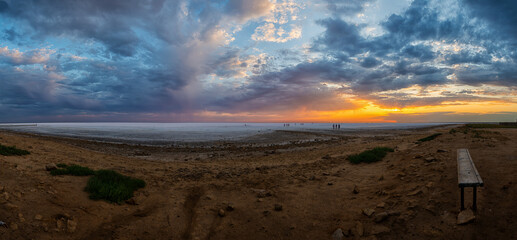 Elton Salt Lake at sunset with beautiful clouds and warm sunny color.