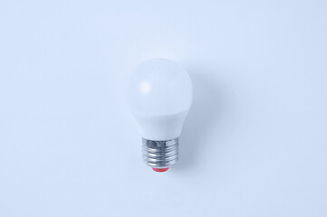 LED lamp on white background. View from above. Electrical accessories.
