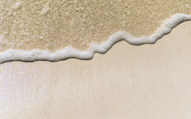 seashore with foam in the caribbean close up