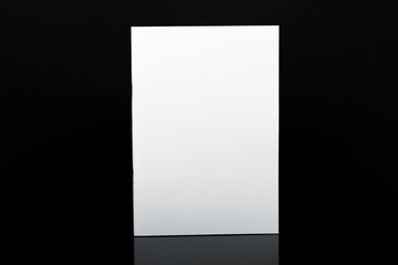 Photo of Blank Magazine Or Brochure or book Cover Isolated On Black background. 