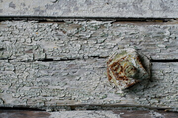 Old wooden surface with traces of paint peeling over time