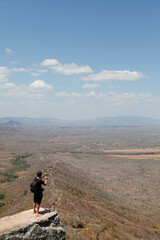 Fototapeta premium man on top of the mountain looking at the horizon