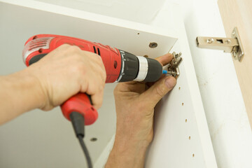 Metal hinges, door loop established on a crewdriver screw, hinges wooden door close up.