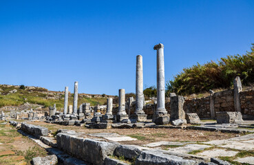 Fototapeta premium The Colonnaded street in the ruins of the ancient greek city of Perge, Pamphylia, Antalya Province, Turkey