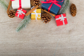 Christmas holidays composition with decorations, presents, pine cones and plants on white wooden board background with copy space for your text. Flat lay, top view