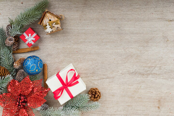 Christmas holidays composition with decorations, presents, tree balls, pine cones and plants on white wooden board background with copy space for your text. Flat lay, top view