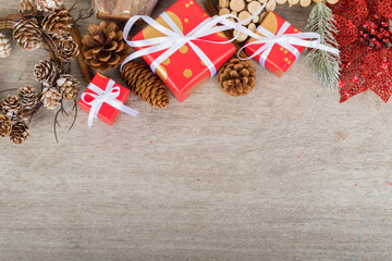 Christmas holidays composition with decorations, presents, pine cones and plants on white wooden board background with copy space for your text. Flat lay, top view