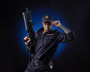 the guy in the police uniform with a gun is a Russian policeman. English translation of 