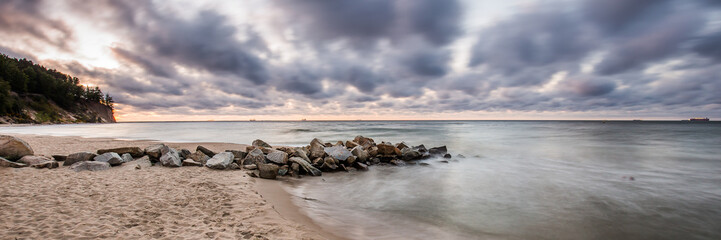 stormy sunrise over the baltic sea in Gdynia Orlowo, Poland 