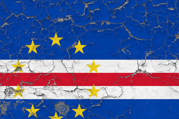 Cape Verde flag close up grungy, damaged and weathered on wall peeling off paint to see inside surface. Vintage concept.