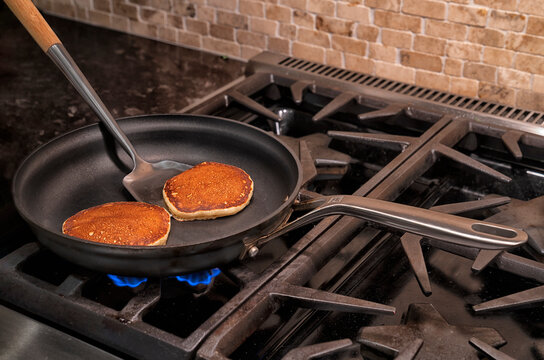 Hot pancakes cooking in a pan