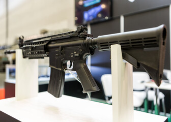 Black machine at the exhibition. Assault rifle