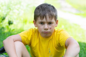 dissatisfied child, with sadines on his face, close-up