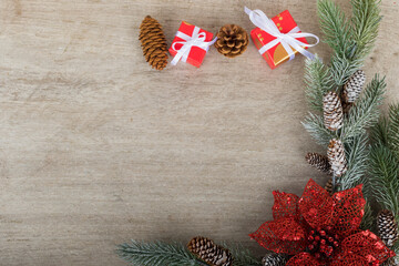 Christmas holidays composition with decorations, presents, pine cones and plants on white wooden board background with copy space for your text. Flat lay, top view