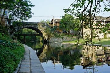 Fototapeta premium Longevity Bridge crosses a canal in the ancient town of Daxu, Guangxi Province, China