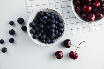 Close-up of cherries and blueberries on a wooden Board. Fresh berries