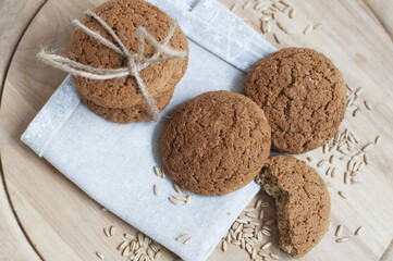 Oat cookies with oat grains on a white background. Top view