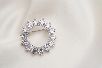 Silver brooch with small diamonds,  isolated on white background. 