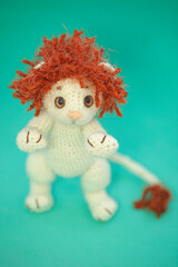 Portrait of white crocheting toy lion