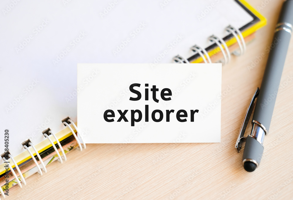 Aufkleber web site explorer- text on a notebook with a spring and a gray pen
