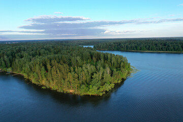 Fototapeta premium natural landscape with river forest and fantastic clouds in the sky