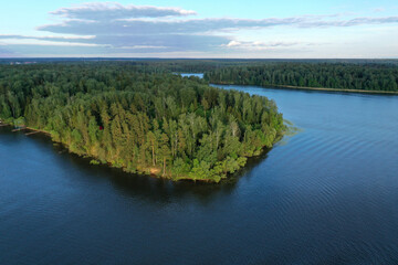 natural landscape with river forest and fantastic clouds in the sky