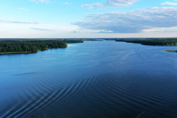 natural landscape with river forest and fantastic clouds in the sky